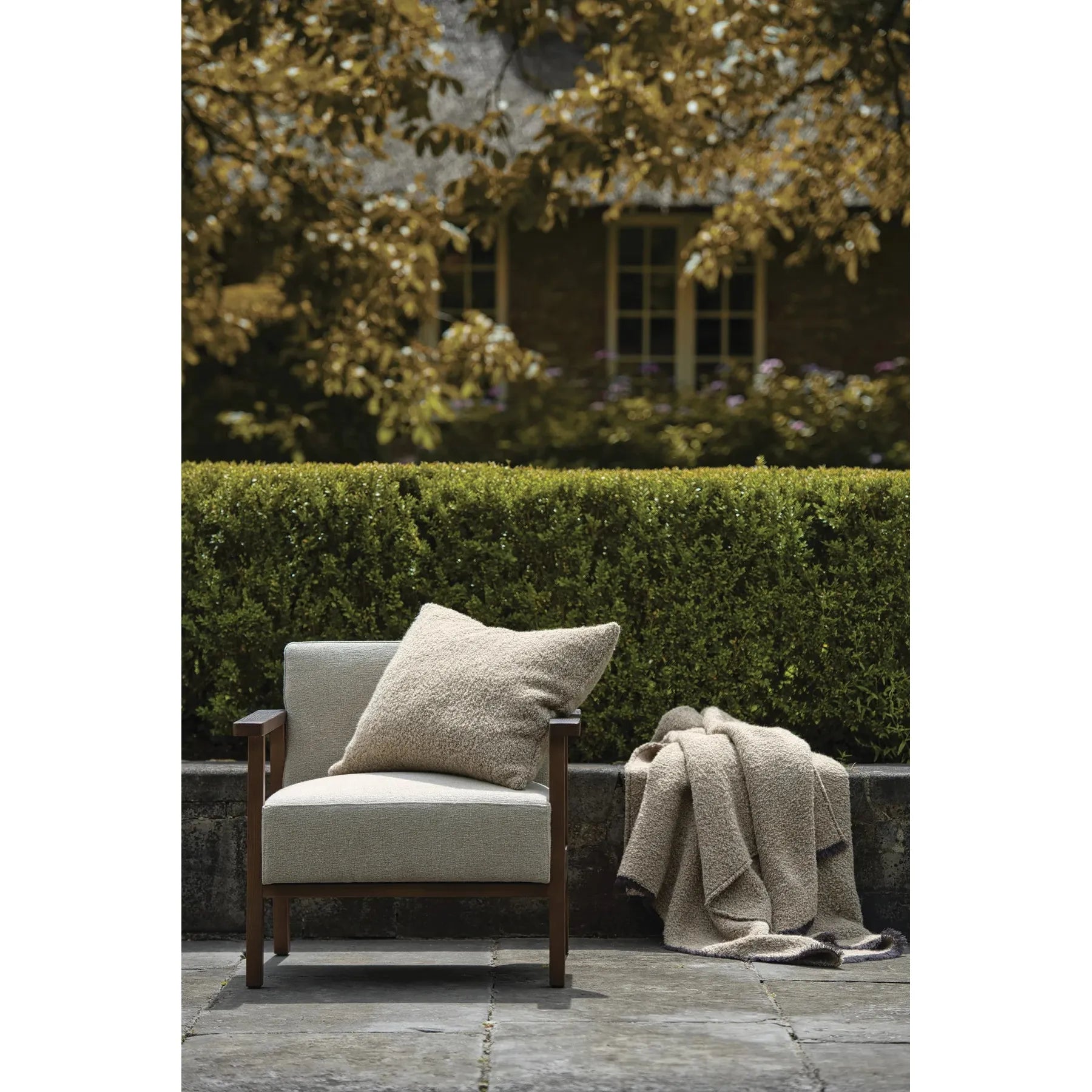Scapa_Home_cushion_and_plaid_Alpone_garden_setting