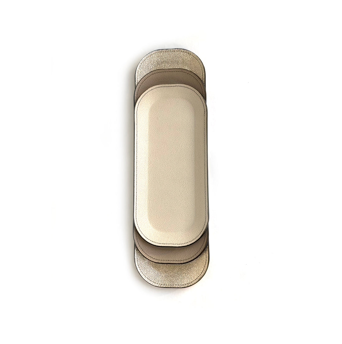 Pinetti_small oval leather_trays_victor stacked platinum_ taupe and off-white