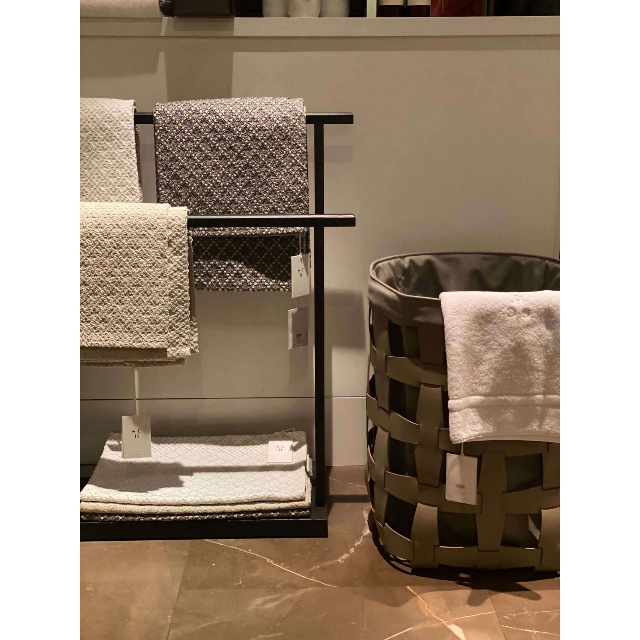 Scapa_Home_bath rugs and towels and Pinetti_leather laundry basket big hook bathroom_setting