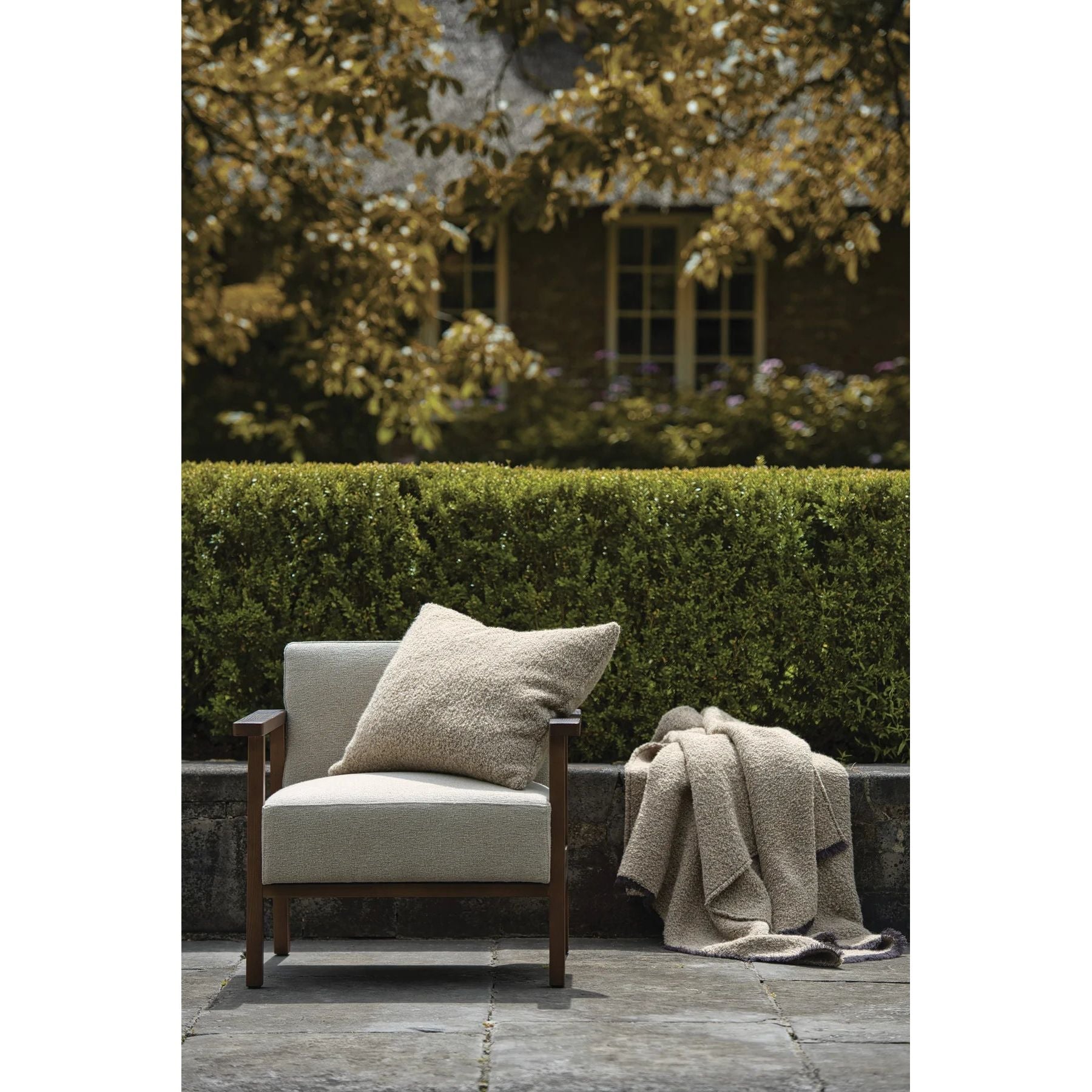 Scapa_Home_cushion_and_plaid_Alpone_garden_setting