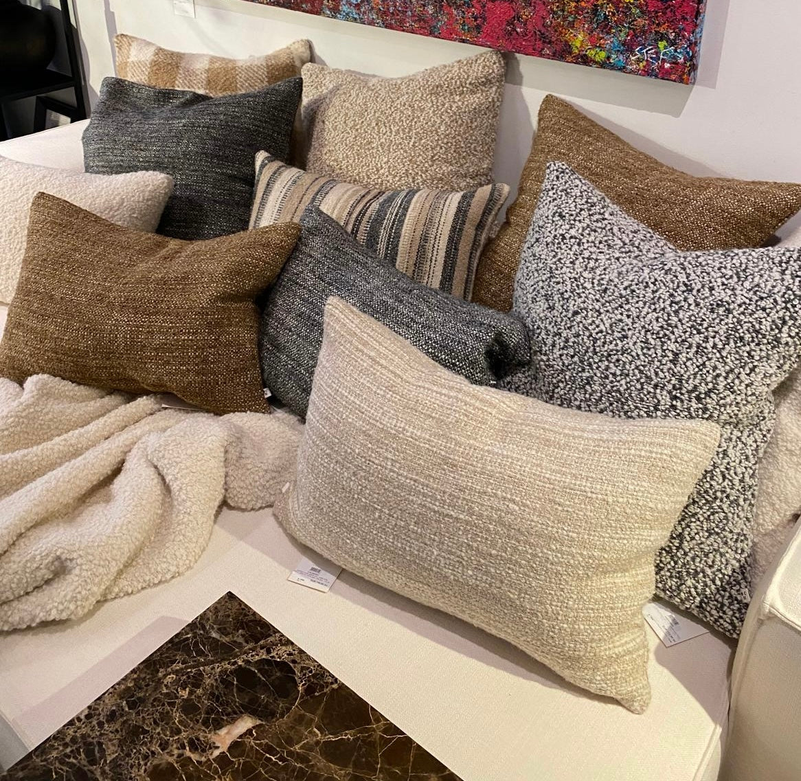 Scapa Home sofa setting with grey, brown and beige cushions