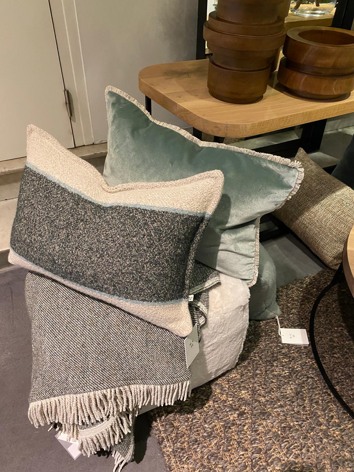 Scapa Home stool setting with grey and blue cushions and plaid